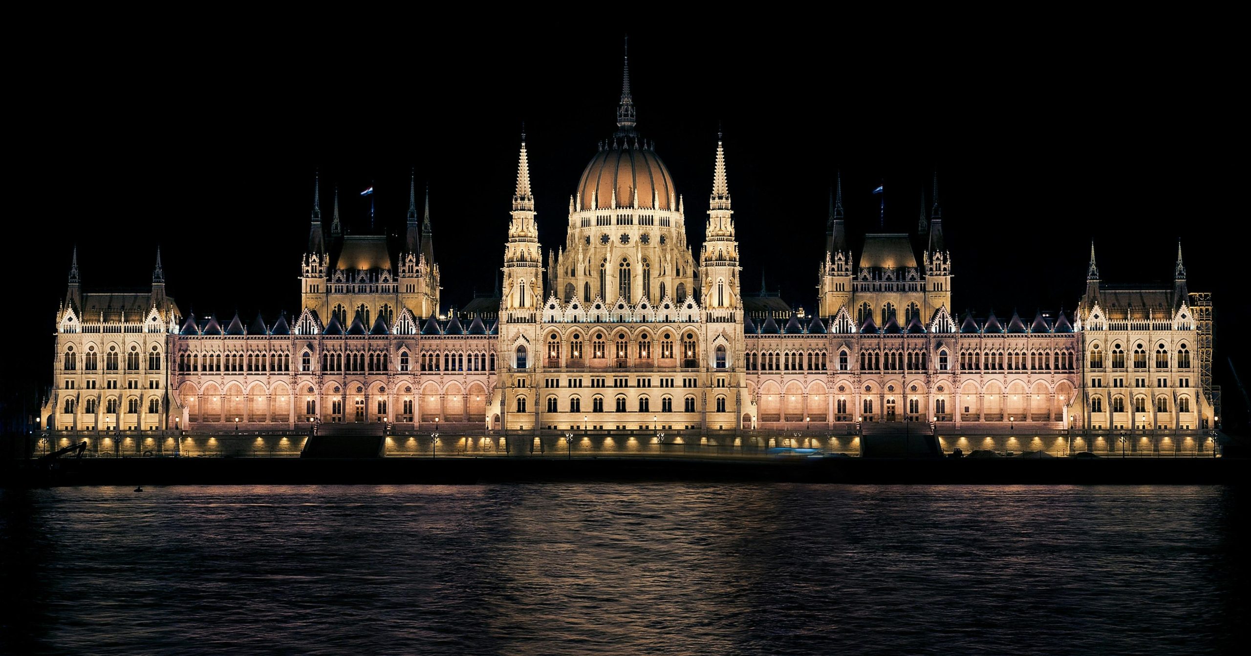 Elegant night view of the illuminated Hungarian Parliament Building in Budapest.