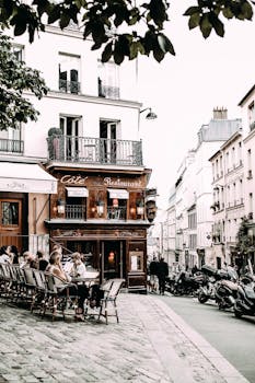 Cozy outdoor cafe on a cobblestone street, perfect for relaxation.