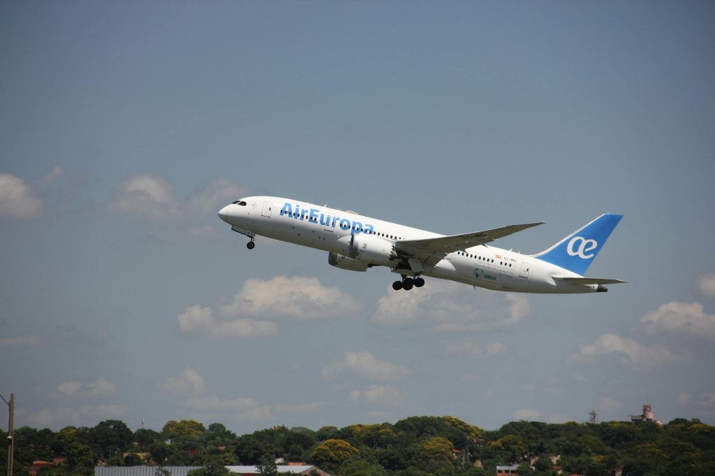 Air Europa airplane in flight during takeoff against a clear sky in Asunción, Paraguay.
