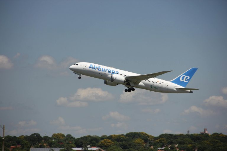 Air Europa airplane in flight during takeoff against a clear sky in Asunción, Paraguay.