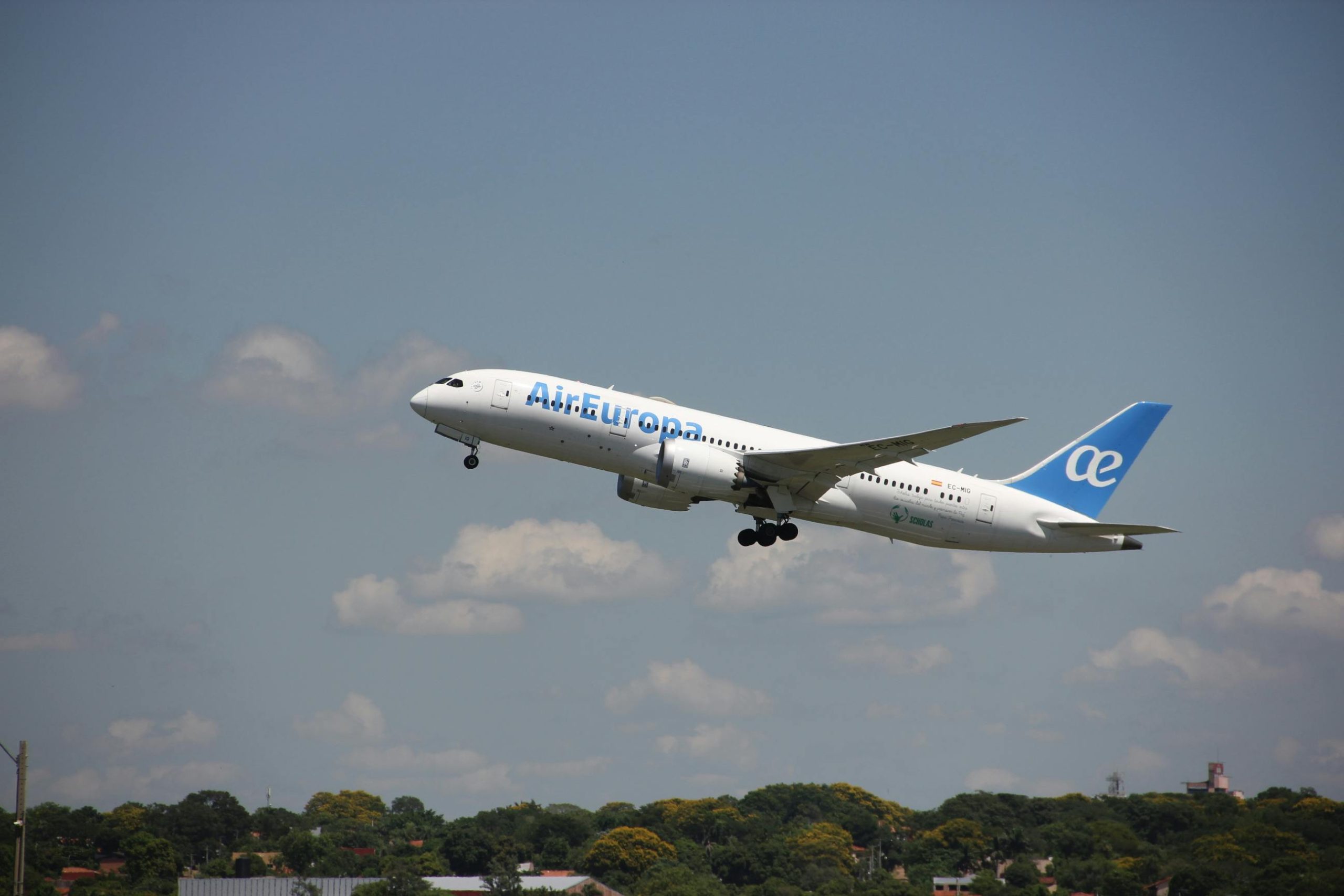 Air Europa airplane in flight during takeoff against a clear sky in Asunción, Paraguay.